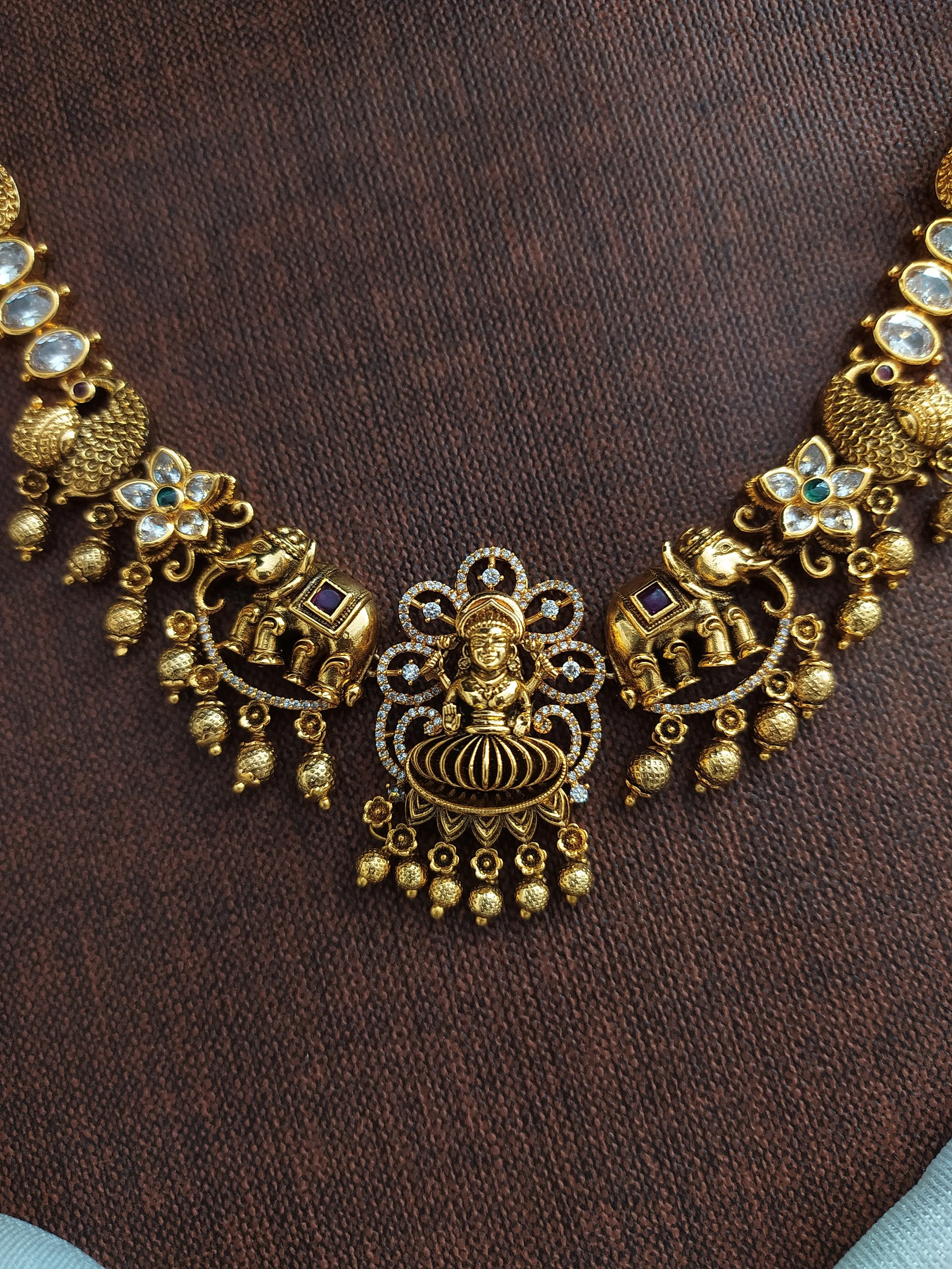 "Antique Lakshmi Necklace Set with Trending Zircon Stones and Nagas Work"